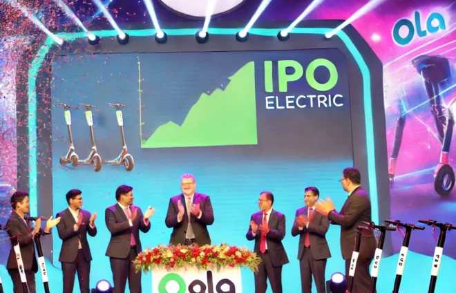 DALL·E 2024-07-30 17.27.46 - An image depicting the IPO launch of Ola Electric. The scene should include a stage with the Ola Electric logo prominently displayed, executives and t